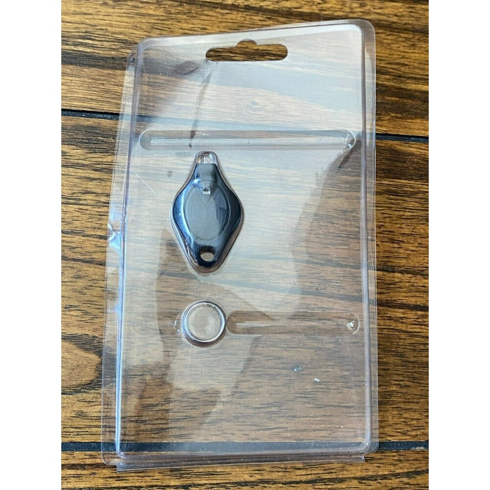 Keychain Micro-Light Flashlight Preowned but never used, in original packaging